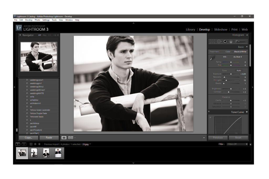 Adobe Photoshop Lightroom being used to edit a photo of a young male model with dark short hair in a black cardigan and light button-up shirt